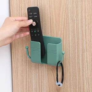 Wall mounted phone holder with hooks, punch-free sticky storage box for home use.