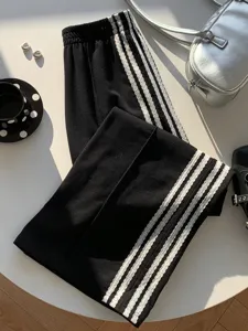 Y2K retro high waist black casual pants with white side stripes, draped chic trousers for women.
