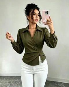 Green wrap blouse for women, elegant V-neck lapel design with long puffed sleeves.
