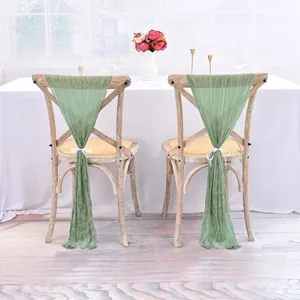 Sage green sheer gauze chair sashes for wedding reception and party decor detail view