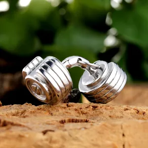 Detailed view of stainless steel dumbbell cufflinks, stylish geometric fitness accessory for men.