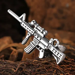 Stainless steel assault rifle pendant for men, detailed punk rock jewelry accessory detail.