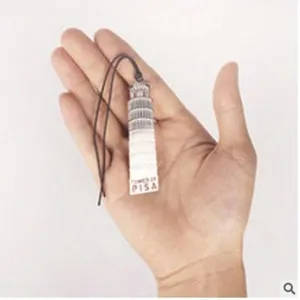 Vintage metal bookmark featuring Leaning Tower of Pisa design with black cord ornament.