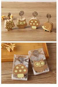 Detailed view of cute wooden animal photo and memo clips with metal wire spiral holders.