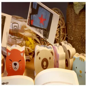 Wooden animal memo clip holder, cute cartoon cat and bear desktop photo display stand detail.