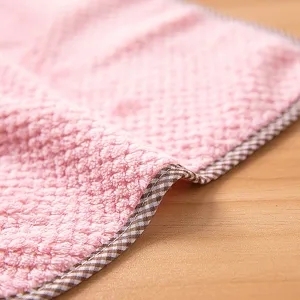 Soft coral velvet cleaning cloth with checkered border, absorbent kitchen hand towel detail view.