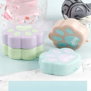 Scatola di immagazzinaggio portatile a forma di zampa di gatto, dolci colori pastellati.