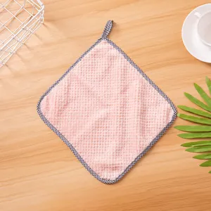 Closeup detail of the pink coral fleece hanging dishcloth with checkered border view.