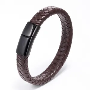 Close-up of brown braided leather bracelet with black magnetic clasp, detailed texture.