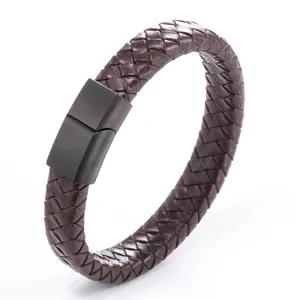 Close-up detail of brown braided leather bracelet with black magnetic stainless steel clasp.