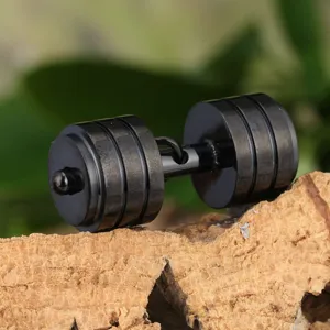 Close-up detail shot of a creative black titanium steel dumbbell pendant, showing sleek metal texture.