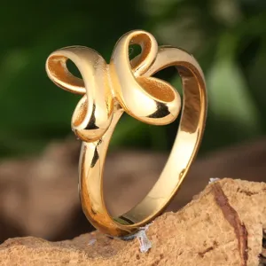 Detail shot of a gold titanium steel cross loop ring, featuring a smooth polished surface design.