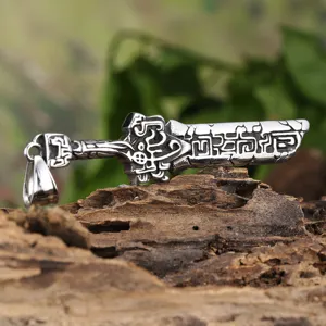 Detailed view of vintage stainless steel knight sword pendant, punk style jewelry closeup.
