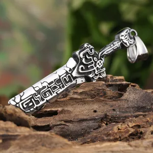 Close-up detail of retro titanium steel broken sword pendant with punk carved pattern.