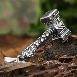 Stainless steel Viking Thor hammer pendant with Valknut symbol detail shot, gothic men jewelry.