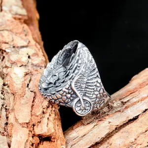 Vintage punk style titanium steel men ring detailed skull wing design close-up view.