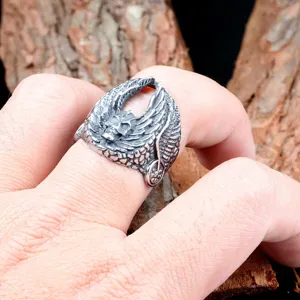Men vintage punk titanium steel ring detailed shot, retro skull eagle wing biker jewelry.