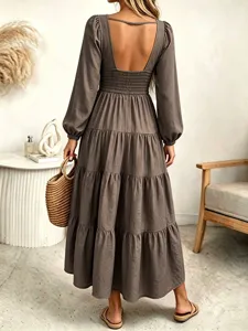 Open back long sleeve tiered maxi dress in brown, chic lifestyle detail view.