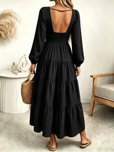 Backless long sleeve black tiered maxi dress detail, elegant French style back view scene.
