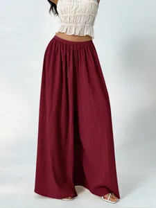 Detailed view of women high waist pleated wide leg pants, casual draped loose trousers.