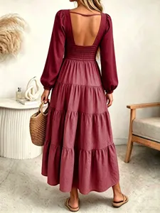 Backless long sleeve tiered maxi dress detail, wine red bohemian style dress showcasing back design.