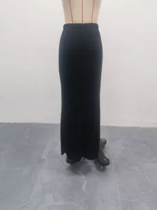 Detail view of the elegant black solid color high waist bodycon long skirt for women.