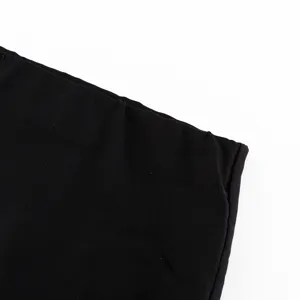 Detailed close-up view of the black fabric and stitching for a women's bodycon skirt.