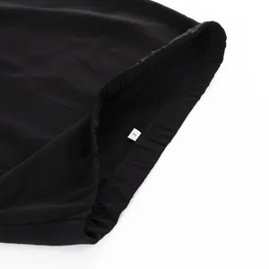 Detailed view of the black bodycon skirt waistline showing the size label and elastic band design.