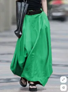 Green maxi skirt for women, high waist A-line design, loose fit long skirt for casual street style.