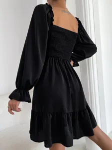 Stylish black long sleeve square neck dress featuring smocked bodice and ruffled hem.