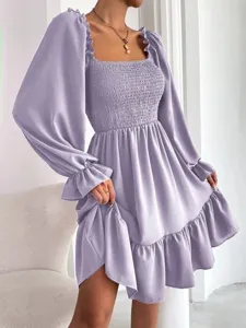 Close-up detail of light purple long sleeve dress featuring square neck and ruffles.