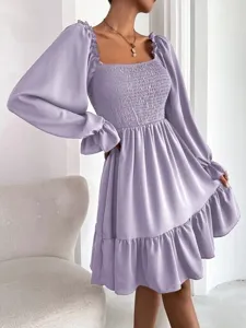Elegant lavender French square neck dress with puff sleeves, smocked bodice and ruffled hem.