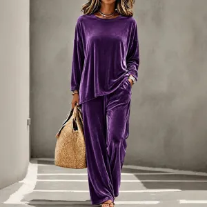 Purple velvet two-piece set featuring long sleeve crewneck top and wide leg pants for women.