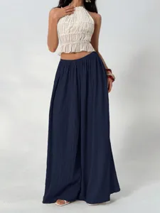 Comfortable pleated wide leg pants for women featuring a high elastic waist and casual drape.