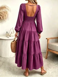 Detailed view of the purple long sleeve tiered maxi dress back design with smocked waist.