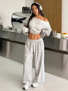 Stylish women's grey leopard print crop top and loose track pants casual matching set.