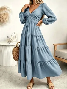 Long sleeve blue maxi dress, V-neck tiered A-line dress, elegant autumn women's apparel.