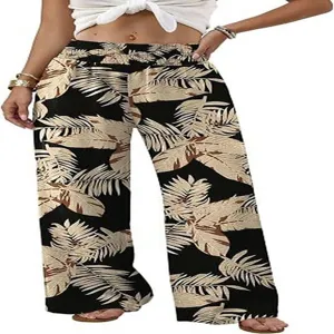 High-waisted wide leg pants detail with tropical leaf print and comfortable casual style.