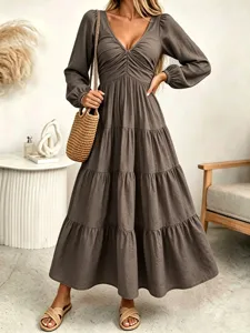 Elegant long sleeve tiered maxi dress with V-neckline, flattering high waist and chic boho style.