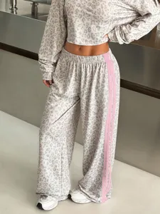 Leopard print wide-leg sports pants for women with contrast pink side stripes, casual style.