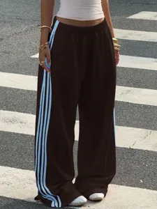 Women brown wide leg sweatpants with light blue side stripes casual streetwear trousers.