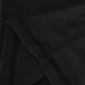 Close-up detail of black yoga pants fabric, showing fine stitching and elastic material.