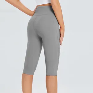 High waist cropped yoga pants for women, solid grey workout leggings with side pockets.