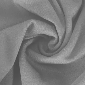 Close-up fabric texture detail showing soft grey stretch knit material for yoga fitness leggings.