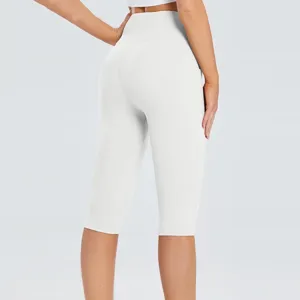 White capri yoga pants for women, high waist slim fit workout leggings for fitness sports.