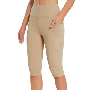 Detail view of women's khaki high-waist side pocket capri yoga pants, slim fit stretch.