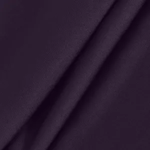 Detailed view of the dark purple stretchy fabric texture for women's yoga fitness pants.