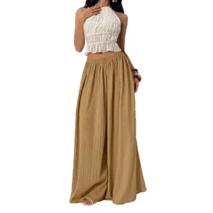 Chic women pleated wide leg pants and halter crop top set, high waist casual summer outfit.