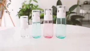 Portable travel spray bottles set, empty cosmetic sub-packaging containers with fine mist pumps.