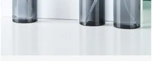 Grey translucent spray bottle detail, portable travel cosmetic dispenser pump bottle empty.